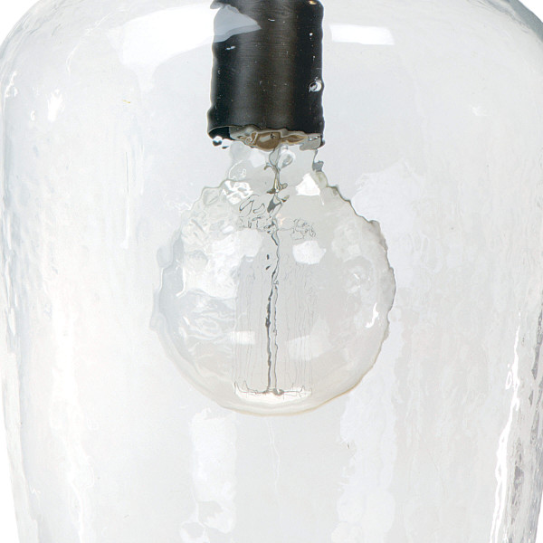 Lightbulb with a black base in a glass pendant